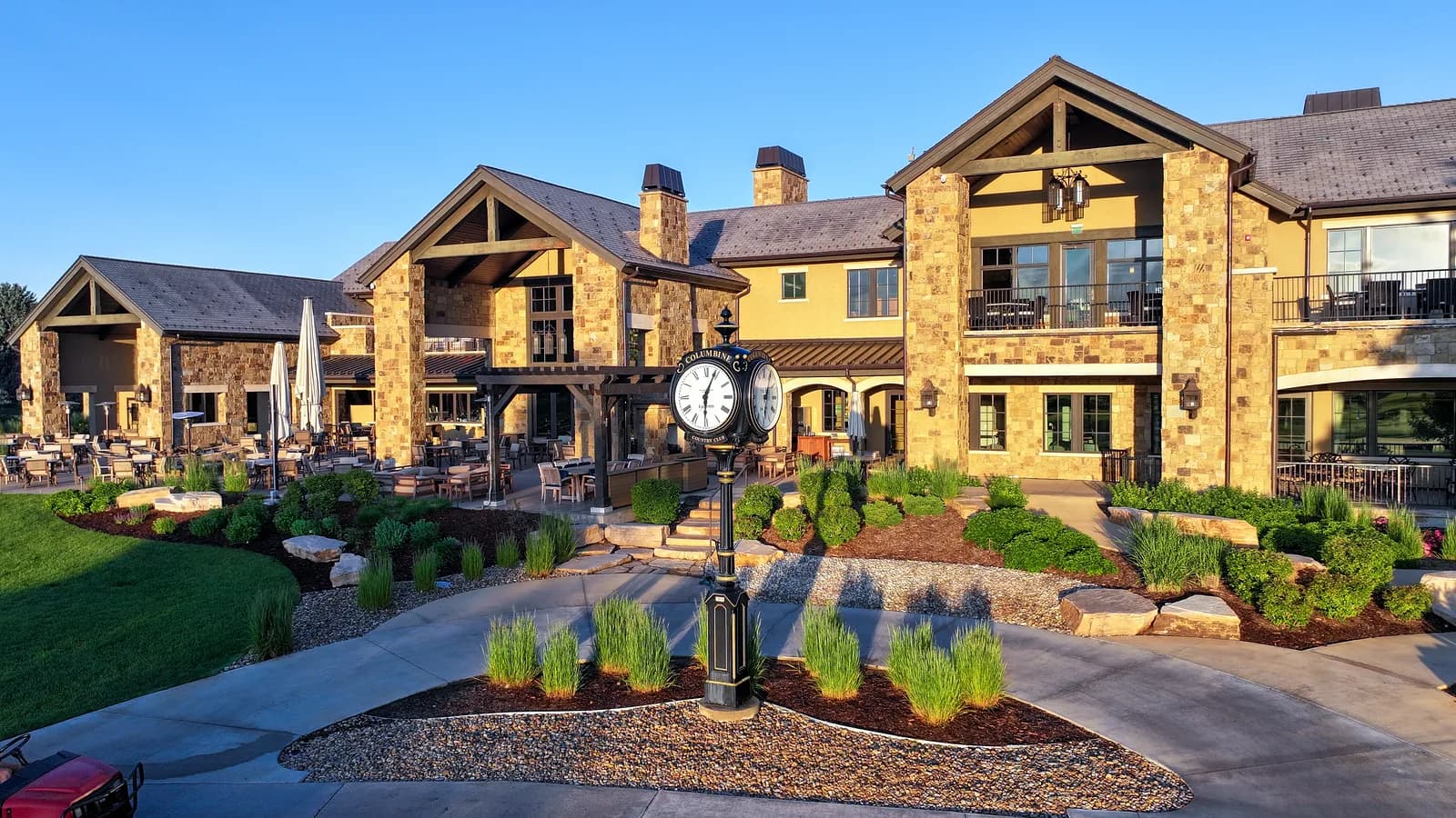 Clubhouse entrance with a classic standing clock at first light